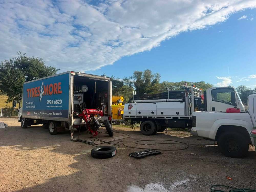Onsite tyre service truck working alongside heavy vehicles
